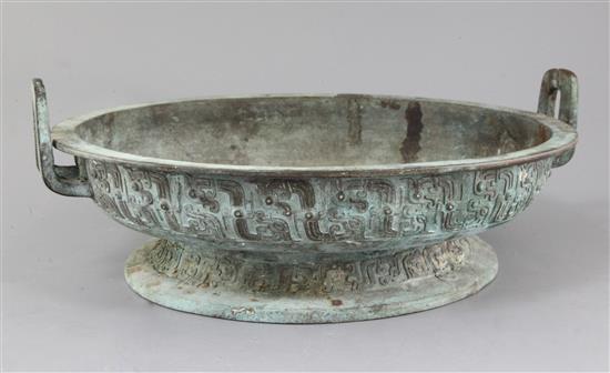 A Chinese archaic bronze ritual water basin, Pan, early Eastern Zhou dynasty, 8th-7th century B.C., 15cm high, 40.5cm, old repairs